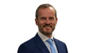 Head and shoulders photograph of Group Chief People Officer, Simon Nearney